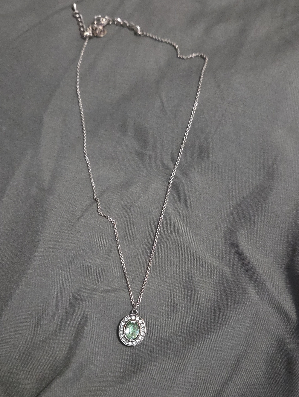 Touchstone Crystal Silver Necklace with Green Oval Center and Crystal Halo